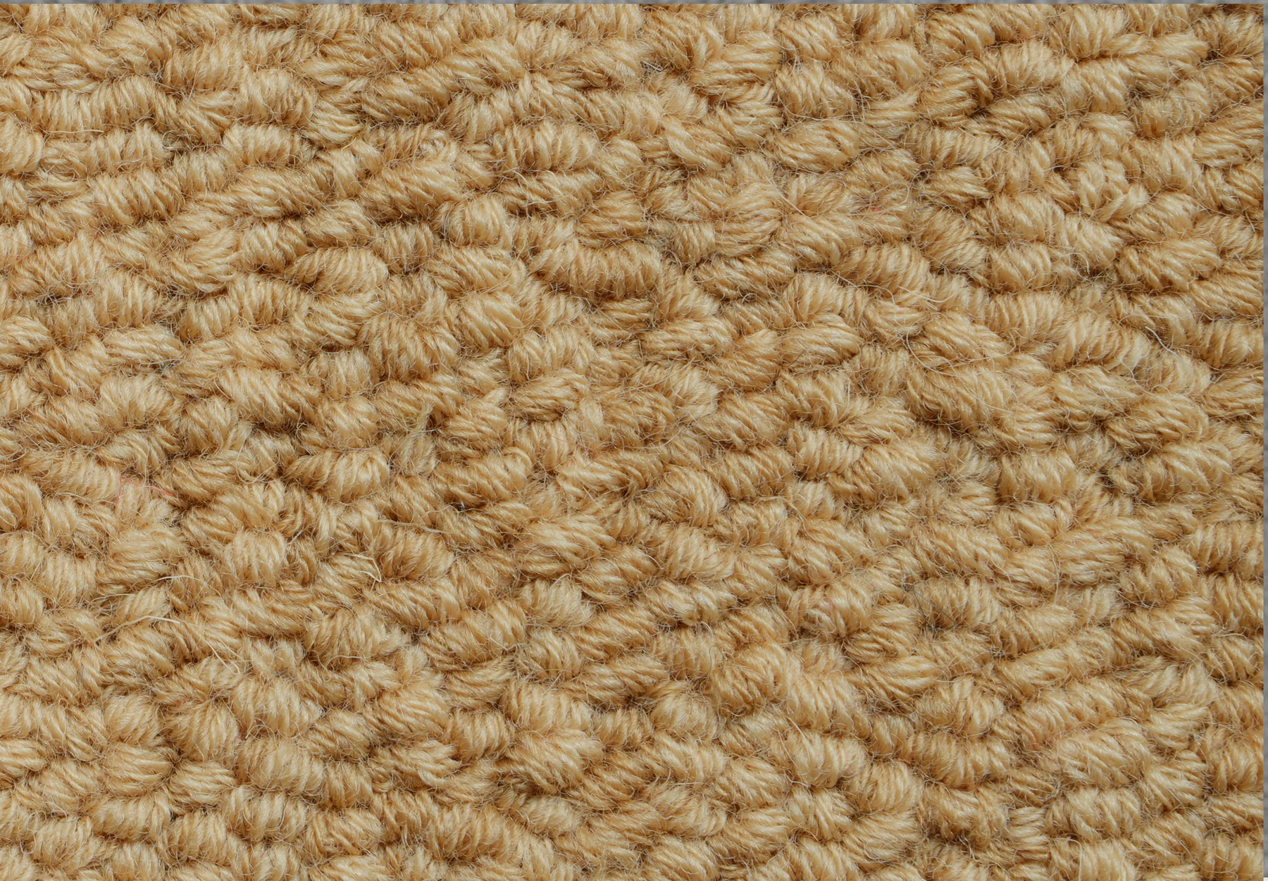 Detalle de los bucles de hilo de una muestra textil.